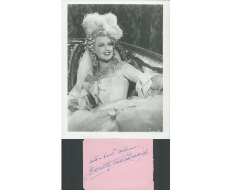 Jeanette MacDonald signed 5x3 album page and vintage 10x8 inch black and white photo. Good condition Est.