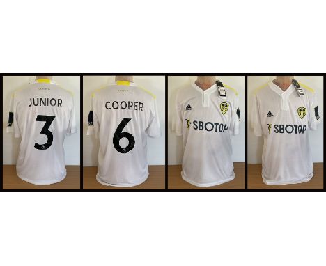 Football Leeds United collection two signed home shirts from Liam Cooper and Junior Firpo. Good condition Est.