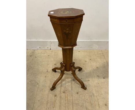 A Sheraton revival satinwood sewing table of trumpet form, early 20th century, the octagonal top opening to an oak lift out t