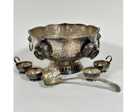 A Sheffield plated lotus form impressive punch bowl with lion mask ring handles to side, with chased floral decoration, raise