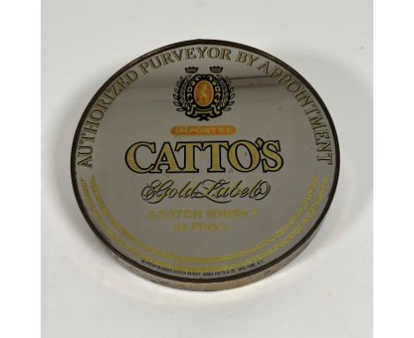 A decorative "Catto's Gold Label Scotch Whiskey 86" circular gold enamelled mirror ( l - 30.5cm w- 30cm)