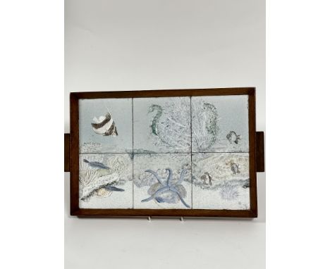 A 1930s oak two handled rectangular tea tray set six handpainted tiles of fish, including sea horses, starfish, conch shells,