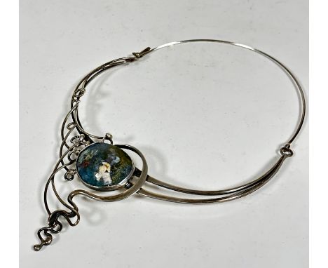 A silver Art Nouveau style necklace with hinged loop to back, set with enamel oval pendant of scrolling design, (22cm x 15cm)