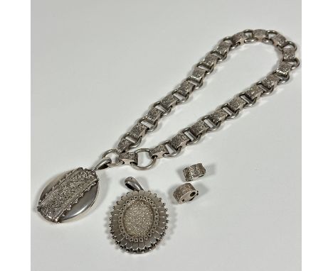 A Victorian circular and oval engraved link necklace with two circular snap open and closed rings, (L:20cm) with two extra li