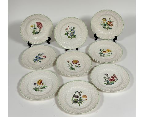 A set of twelve Copeland Spode dinner plates, each decorated with a different flower (marked verso) such as tulip, wild rose,