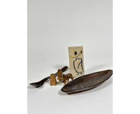 A Haida British Columbian pottery oval shaped dish with sea monster design (2.5cm x 28cm x 11cm) and a handmade clay tile (5c