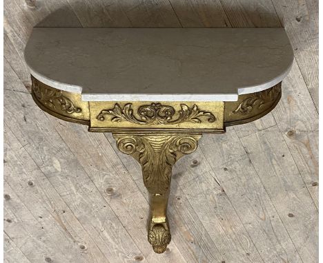 A Rococo style gilt wood and composition console table, the stepped white marble top over acanthus moulded base, H80cm, W63cm