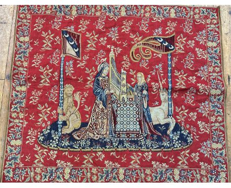 A machine made tapestry La Dame a L'Orgue, after a copy of section of The Cluny tapestries, Le Dame a Licorne (95cm x 110cm)