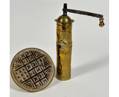 A religious Prosphora bread seal, decorated with runes, (d 12.5cm and reverse side 7cm) and an Eastern brass circular column 