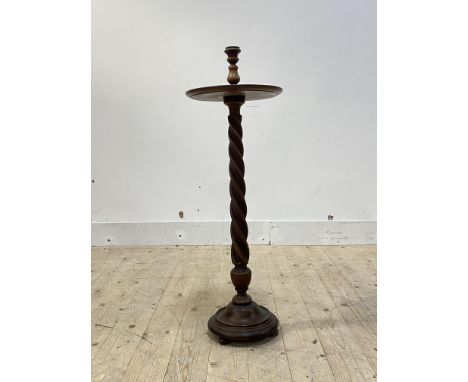 An early 20th century spiral turned mahogany floor standing candle stick H90cm