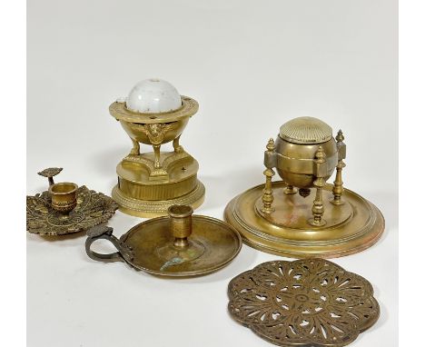 A 19thc nautical style holder with brass incised dial and ceramic part gilded ink well, raised on triple wing lined support, 