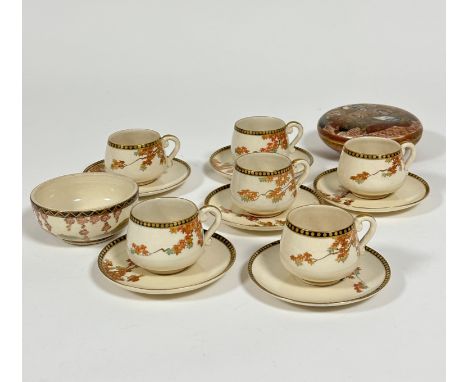 A set of six Japanese satsuma coffee cans and saucers decorated with Autumn sprays of acer tree with black dotted borders, on