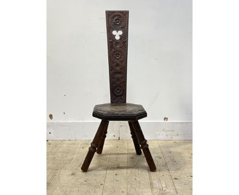 A carved walnut spinning chair, the octagonal seat on four ring turned supports, H91cm