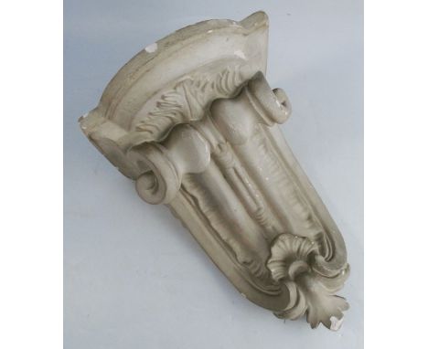 A 19th century cast and painted c-scroll shaped plaster wall bracket