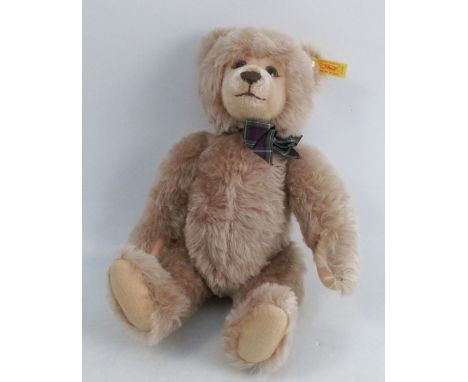 A modern Steiff teddy bear, makes a sound when shaken, height 14ins, together with Steiff paper bag