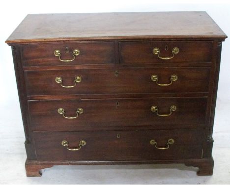 A 19th century mahogany chest, of two short over three long graduated drawers, with fluted columns to the ends, raised on bra