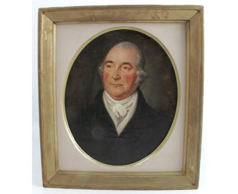 An English school oil on canvas, oval portrait of a man wearing a white cravat and black coat, maximum diameter 10.5ins