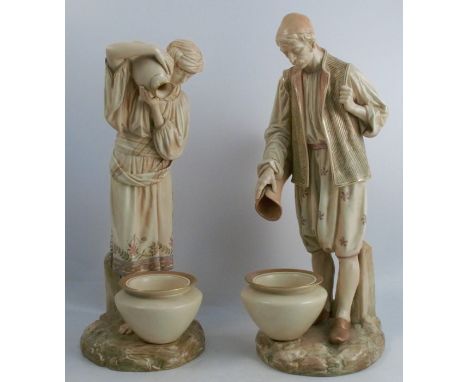 A pair of Royal Worcester blushed ivory figures, of Eastern water carriers, modelled as a man and a lady pouring water from a