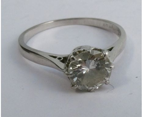 A solitaire diamond ring, the white mount stamped 18ct, the brilliant cut measuring approximately 6.3mm by 3.5mm deep, calcul