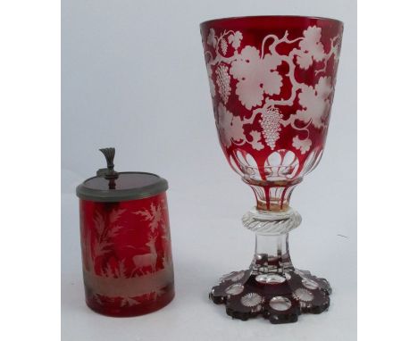 A 19th century Bohemian ruby overlay goblet, engraved with vines, af, height 10.75ins, together with a tankard engraved with 