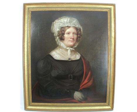 A 19th century English School, oil on canvas, portrait of a woman wearing a white lace bonnet, 29.5ins x 24ins