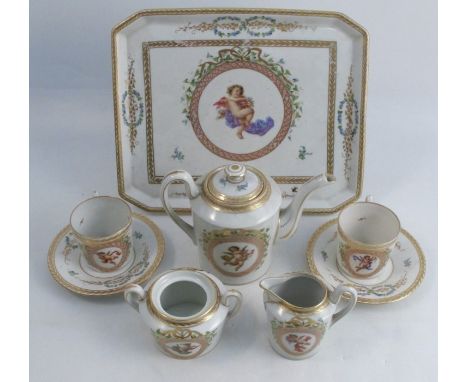 A continental porcelain cabaret set, comprising a tray, two coffee cans and saucers, coffee pot, milk jug and sugar bowl, all