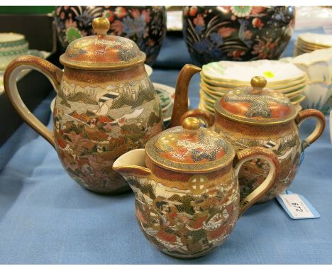 A 15 piece Meyii period Japanese pottery Satsuma teaset, comprising 6 cups and saucers, teapot, milk jug and bowl decorated w