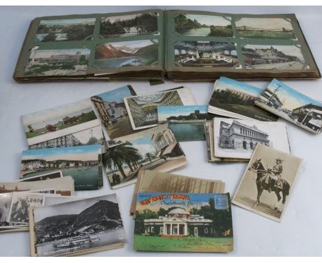 An album of postcards, to include mainly topographical views, and some portrait cards, together with a quantity of loose post