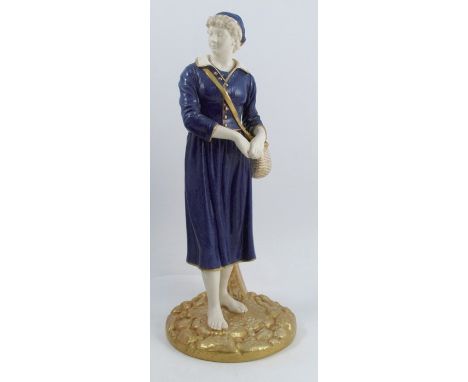 A Royal Worcester model, of a French Fisher Girl, decorated in mottled blue and gilt to a parian ground, raised on a gilt bas