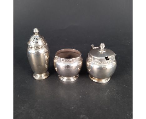 A silver three piece cruet set with Celtic band design, hallmarked Birmingham 1941, maker Adie Brothers Ltd, weight approx 12