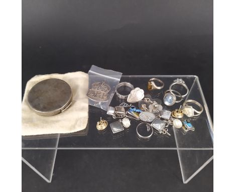 A mixed lot of silver items including six silver rings, silver earrings, cufflinks, necklaces and a silver compact with engin