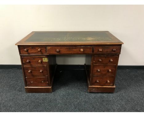 A Victorian mahogany twin pedestal desk fitted nine drawers 