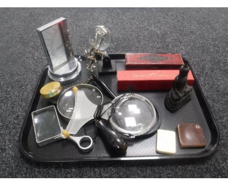 A tray of assorted magnifying classes, atmospheric pressure gauge, Hohner chromonica etc
