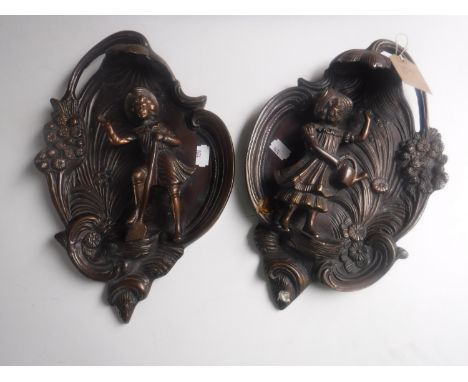 A pair of continental bronze wall plaques 