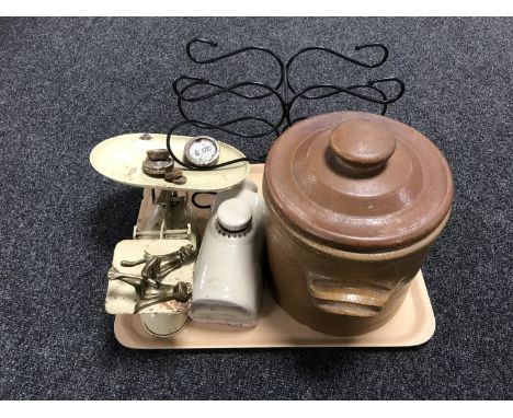 A tray containing vintage stoneware crock with lid, stoneware hot water bottle, vintage scales and weights, metal wine rack