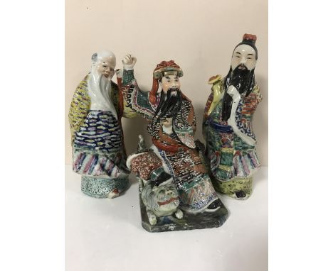 Three early 20th century Chinese ceramic figures of warriors and elderly men 