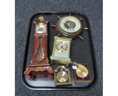 A tray of circular ship's wheel barometer, four assorted desk clocks, Weiss carriage clock and an eight day miniature longcas