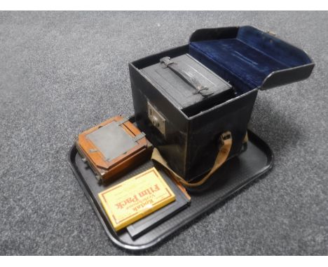 A vintage leather cased R. B. Graflex plate camera together with a Kodak film pack etc  CONDITION REPORT: In the closed posit