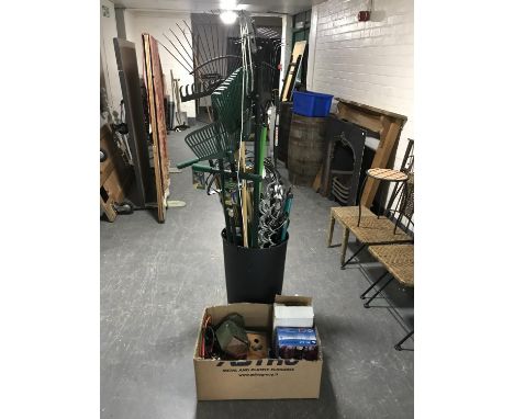A plastic bin of garden tools - rakes, bamboo rods, window baskets etc box of bird houses, security spikes, spot lamps etc 