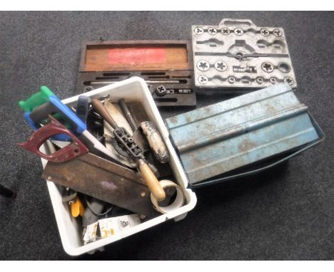 A plastic crate and tool box of vintage hand tools and saws, two cased tap and die sets 