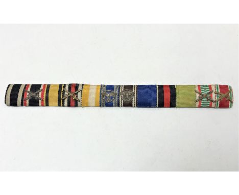 An interesting German First and Second World War (Third Reich) medal ribbon bar, comprising German Iron Cross 1914, War Merit
