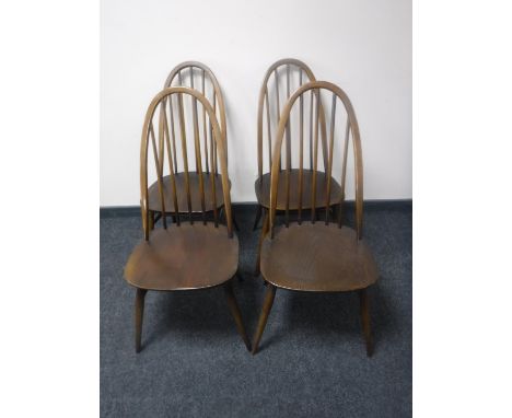 A set of four Ercol high backed dining chairs