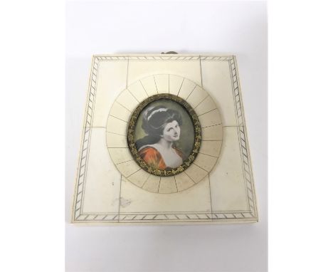 A portrait miniature depicting a lady wearing a red dress, 9.5 cm x 10.5 cm.