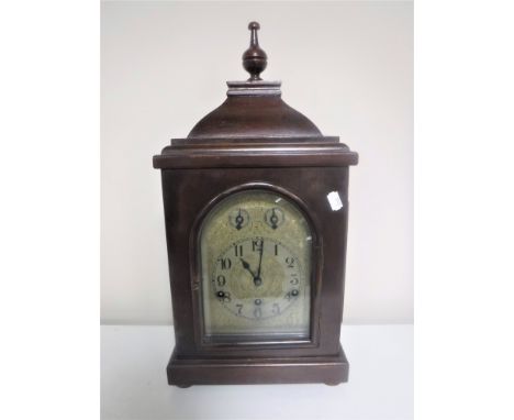 A German bracket clock on bun feet 