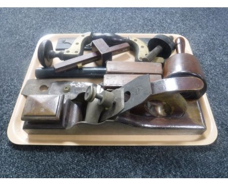 A tray containing antique woodworking tools 