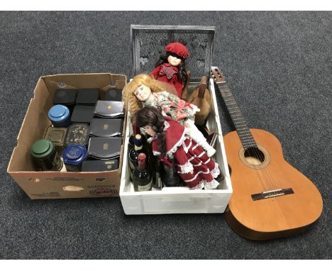 An acoustic guitar together with two boxes containing metal tins, collector's dolls, planters, ornaments, six bottles of wine