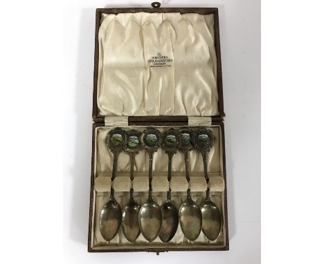 A set of six silver and enamelled teaspoons, inscribed S. Sgt. R. Henderson, R.A.M.C.', the handles with enamelled decoration