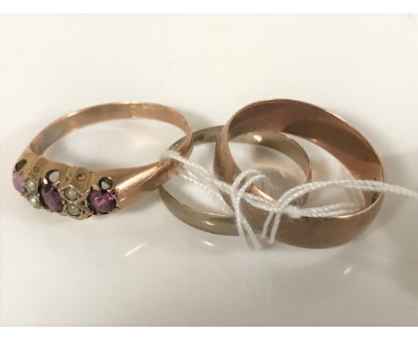 A Victorian amethyst and pearl ring, a 9ct gold band ring and another band ring indistinctly stamped (3)