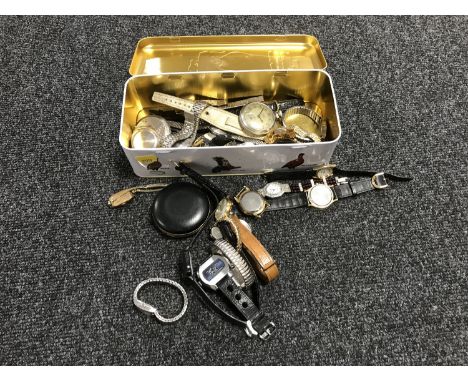 A tin containing various lady's and gent's wristwatches together with a mid 20th century desk clock