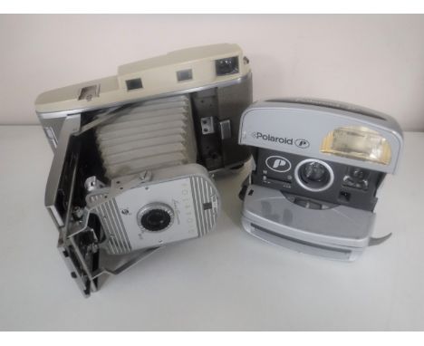 A vintage Polaroid camera and one other 